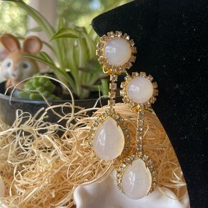 Gold tone drop clip on earrings.